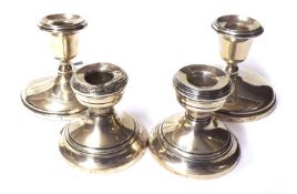 A pair of George V Dressing Table Candlesticks, with spreading circular loaded bases, 3 ¼” tall,