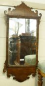A Georgian Fretwork Framed Oak and Walnut Wall Mirror of typical form, some losses to woodwork and