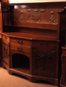 An Arts & Crafts Large Oak Sideboard, the back applied with a central copper panel embossed with Art