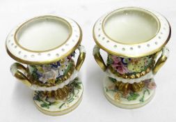 A pair of Bloor Derby Miniature Urns, decorated with floral encrustations and gilt highlights,