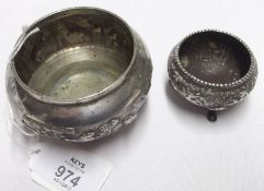 An Indian White Metal Small Bowl of circular baluster form, embossed with a continuous tiger hunting
