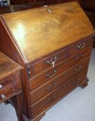A 19th Century Mahogany Bureau, fall front over a fitted stepped interior with central cupboard,