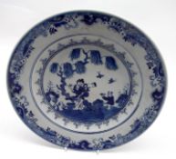 A Chinese Circular Plate painted in underglaze blue with central scene of figures within a