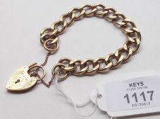 A heavy hallmarked 9ct Gold Solid Curb Link Bracelet with engraved padlock, weighing approximately