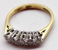 A hallmarked 18ct Gold five small brilliant cut Diamond Ring, claw setting