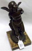 An unsigned Bronze Study of a winged putto standing with a robe and quiver behind, raised on a