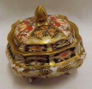 A small Royal Crown Derby Covered Shallow Jar, decorated typically in the Imari style (cracked and