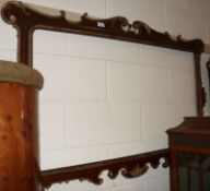 A large Rosewood and Parcel Gilded Picture Frame, with “C” scroll borders, applied beading and