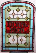 An early 20th Century Leaded Glass Panel, inscribed “Fitting Room”, of rectangular form with