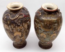 A pair of early 20th Century Satsuma Baluster Vases, the necks moulded with dragons and decorated