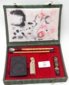 A 20th Century Oriental Boxed Presentation Set, comprising a Table Seal, Brushes, Tablet etc