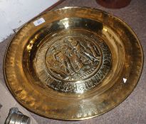 A Vintage Brass Wall Charger decorated with central panel of Adam and Eve, 15” diameter