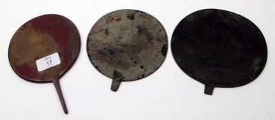 An Oriental small circular Face Screen and two other base Metal examples with missing handles (3)