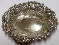 An Elizabeth II Bon-Bon Dish in Victorian taste, pierced and embossed with foliate designs, 6” x 5”,