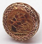 A George V Gold Sovereign dated 1914 within a hallmarked 9ct Gold filigree ring mount