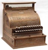 An early 20th Century Brass Cash Register, manufactured for the English market by The National