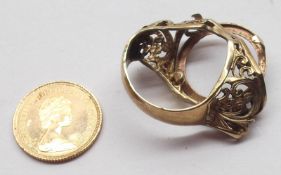 An Elizabeth II Gold Half Sovereign 1982 plus a very distressed 9ct Gold Ring Holder