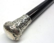 A Vintage Ebonised Walking Cane with Birmingham hallmarked Silver Top with embossed floral