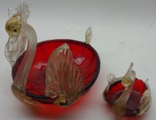 A large 20th Century Ruby and Clear Glass Model Swan; together with similar smaller example, the