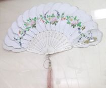 A late 19th Century Paper Fan, with hand-painted flower decoration, mounted on pierced bone