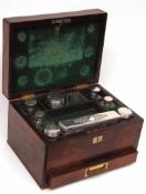 An early Victorian Rosewood Travelling Case, fitted with four hallmarked Silver and four white metal