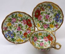 A Hammersley & Co floral and gilt decorated China Trio, manufactured for John Bates & Co of