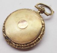 A Victorian Gold Circular Locket with engine-turned back and front, foliate engraved surround and