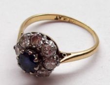 An 18ct Gold and Platinum centre Blue Sapphire and eight brilliant cut Diamond Surround Cluster Ring