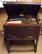 A Vintage Concert Grande Cabinet Gramophone, housed in oak cabinet raised on barley twist supports