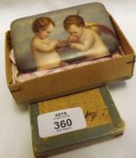 A Continental hard paste rectangular Plaque with printed decoration of two cherubs, decorated in