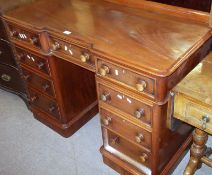 A Victorian Mahogany Desk, the back with a short pediment over a central inverted frieze drawer