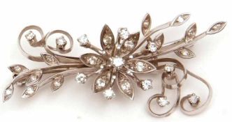 An unmarked precious metal all small Diamond set Spray Brooch with flower head centre, 55mm x 26mm