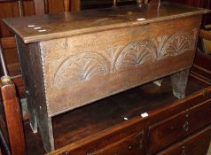An Oak Coffer or Sword Chest, plain rectangular top over a frieze decorated with three half-