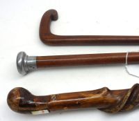 A Mixed Lot: three Vintage Walking Canes, to include a twisted hazel example, all approx 33” long