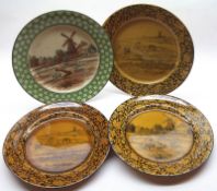 A group of four Doulton 10 ½” Plates, decorated with pastoral scenes, one with extensive damage
