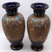 A pair of Doulton & Slaters Patent Stoneware Baluster Vases, typically decorated with floral