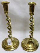 A pair of late 19th/early 20th Century Brass Candlesticks, the stems formed as double barley twists,