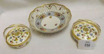 A pair of small Minton floral decorated Posy Baskets with removable lids; together with a Schumann