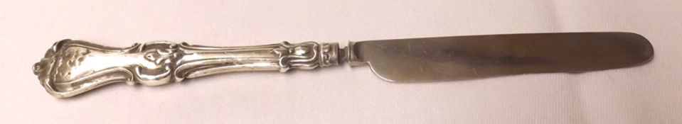 An early Victorian Fruit Knife with plain blade and decorative shell ended handle (with defects),