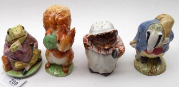 A collection of four Beswick Beatrix Potter Figures: “Mr Jeremy Fisher”, BP3B; “Tommy Brock” 2nd