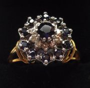 A last quarter of the 20th Century hallmarked 9ct Gold Cluster Ring, set with small Sapphires and