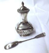 An Edward VII Baluster Pepper, oval shaped with embossed decoration, 4” tall, Birmingham 1905;