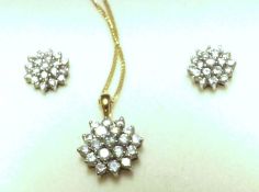 An all brilliant Diamond set of circular flower head Pendant and pair of matching stud Earrings, the