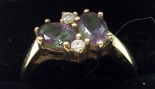 A hallmarked 9ct Gold two oval Amethyst and two small brilliant cut Diamond Ring