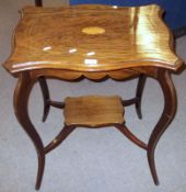An Edwardian Rosewood occasional table of serpentined rectangular form, the top inlaid with