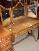 An early 20th Century Walnut Veneered Drop Leaf Sofa Table with two frieze drawers, raised on