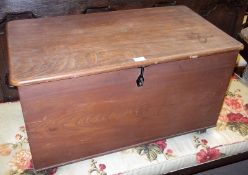 A 20th Century grained Pine Coffer of rectangular form with rounded corners, 33” long