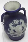 A Miniature Wedgwood Jasperware double-handled Vase, decorated with a white sprig of The Arms of
