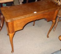 An Oak Fold Top Tea Table with a shaped frieze, raised on cabriole legs (constructed from period