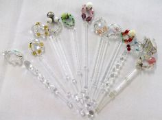 Approximately ten Clear Glass Lace Bobbins finished with glass bead spangles